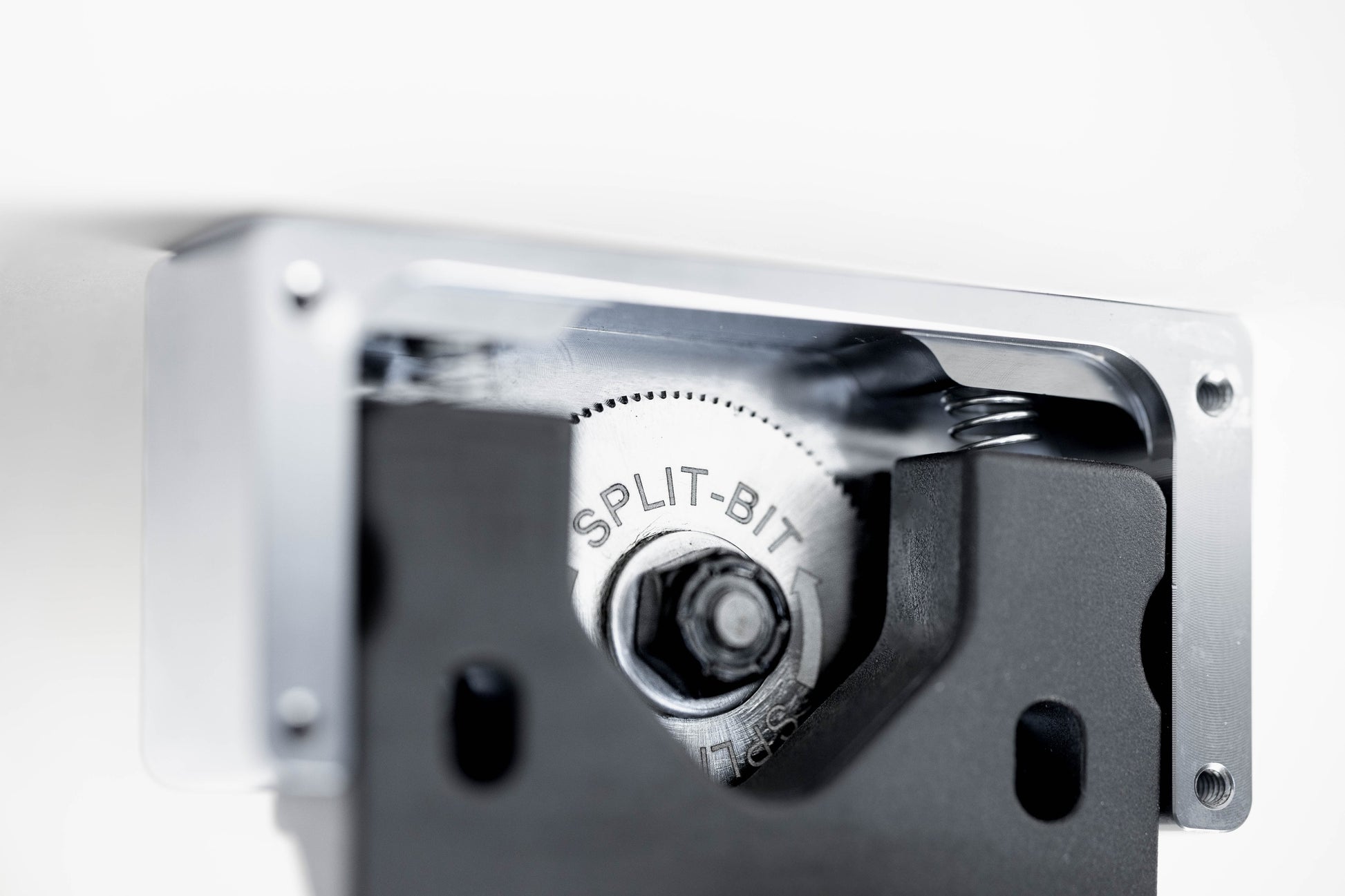 Metallic component with a bolt labeled 'SPLIT-BIT' on a white background